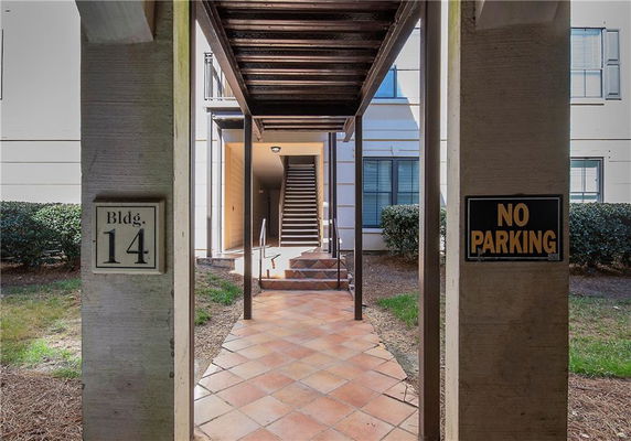 Entrance view of a building with stairs leading up, marked as Building 14.