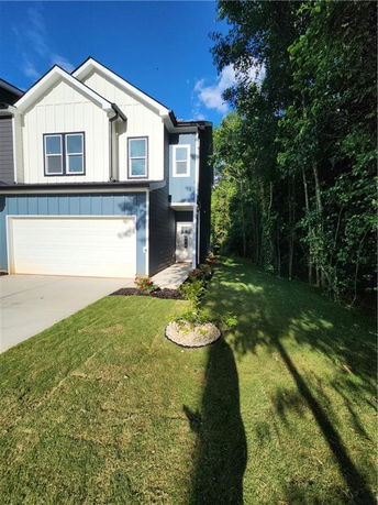 Front view of a two-story house with a double garage and modern design.