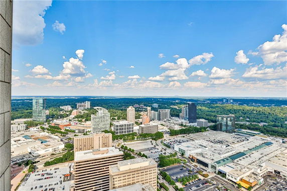 Panoramic view of a city with multiple skyscrapers and buildings.