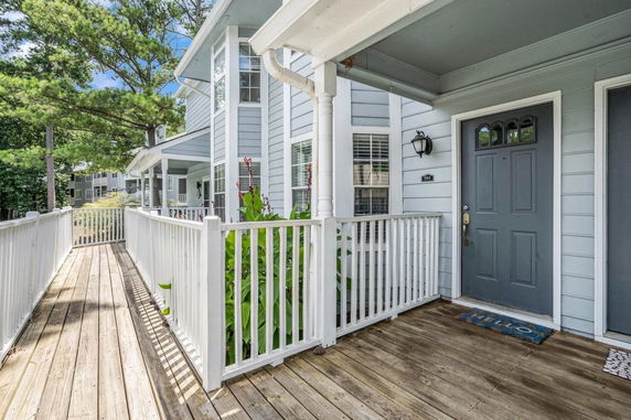 Front view of a house with a walkway and porch entrance