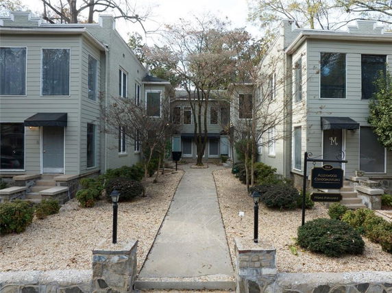 Front view of a multi-story condominium complex.