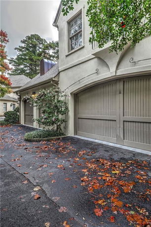 Front view of a house with double garage doors.