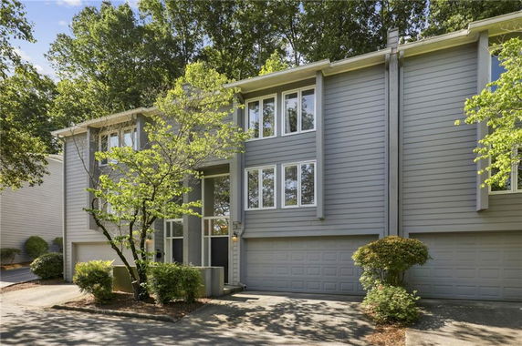 Front view of a two-story house with a double garage.