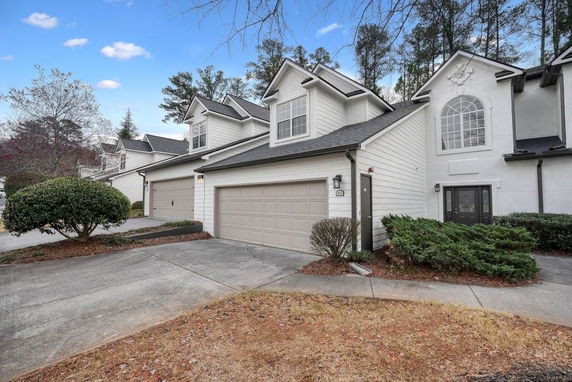 Front view of a two-story house with a double garage.