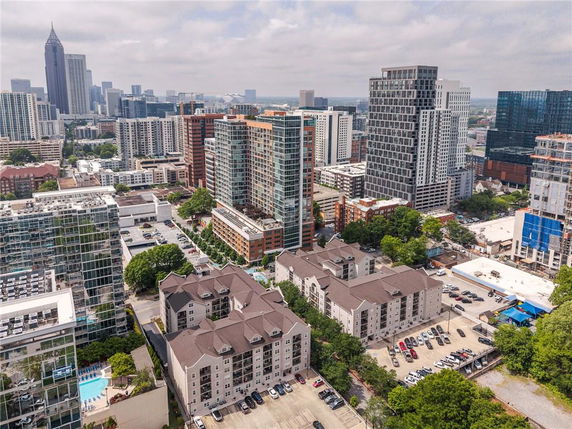 Aerial view of a cityscape with multiple high-rise buildings and residential structures.