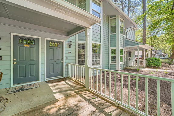 Front view of a two-story house with dual entrance doors and a porch.