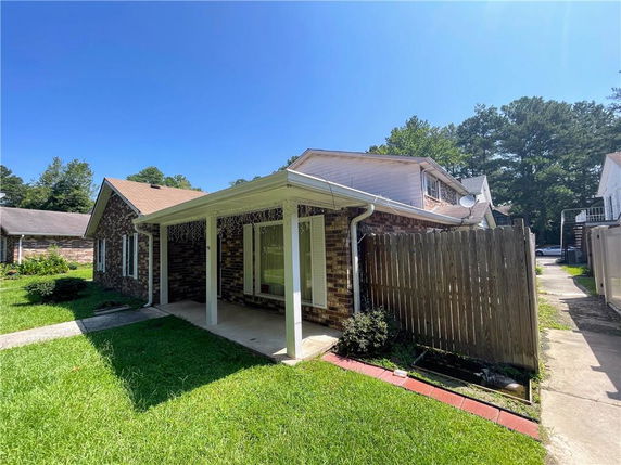 Front view of a single-story house with a covered porch.