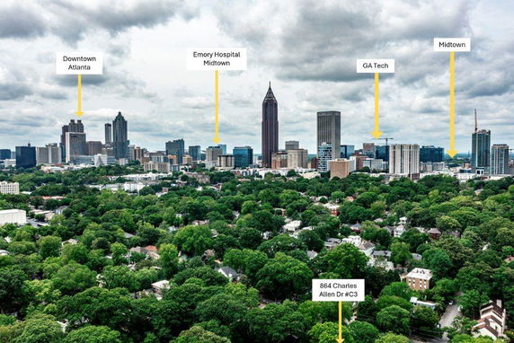 Panoramic view of an urban skyline with various labeled buildings, including Downtown Atlanta and Midtown.