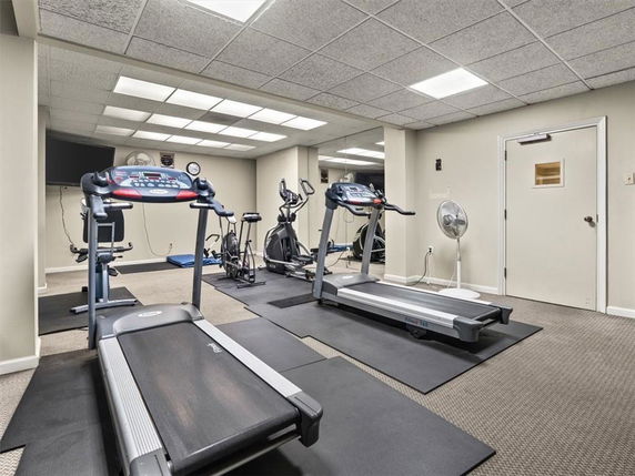 Indoor gym area with treadmills and exercise equipment.
