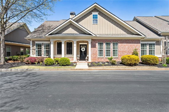 Front view of a single-story house with brick and siding exterior.