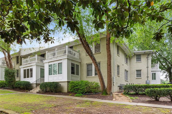 Front view of a two-story residential building with balconies.