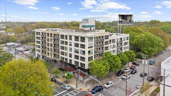 Front view of a multi-story residential building with balconies.