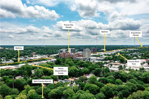 Panoramic view of a city landscape with several landmarks like Ponce City Market and Fourth Ward Park labeled.