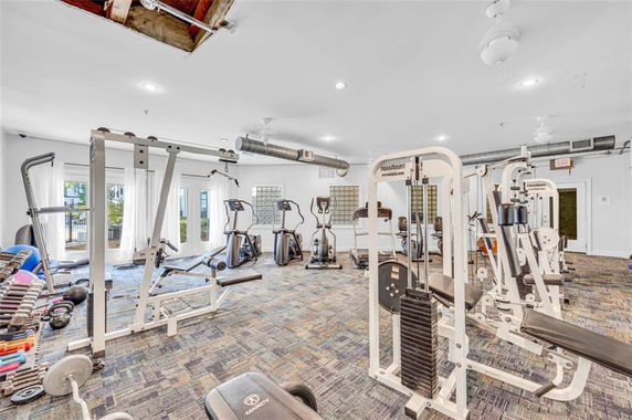 Interior of a gym with various exercise equipment.