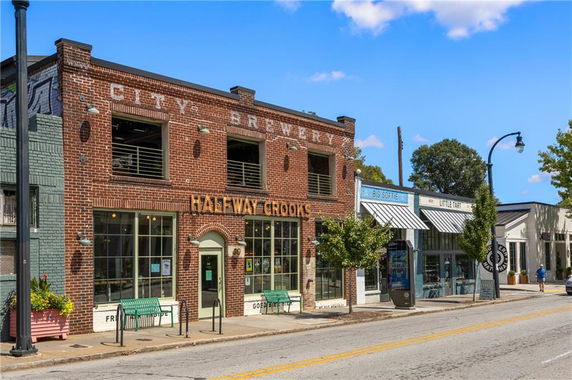 Front view of a brick building with signage for a brewery.
