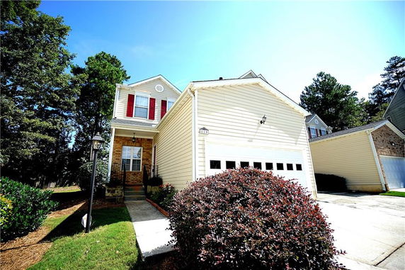 Front view of a two-story house with a double garage.