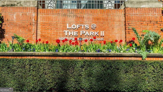 Front view of a brick building with signage reading 'Lofts @ The Park II'.