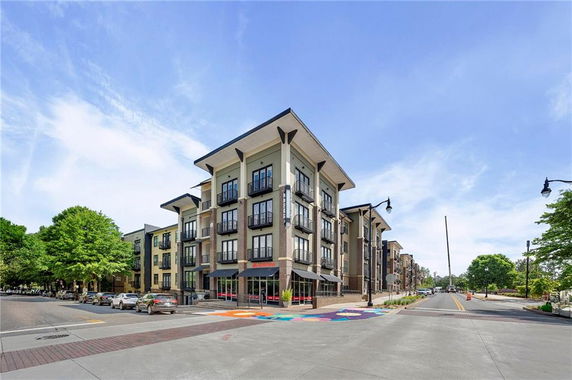 Front view of a multi-story modern apartment building.