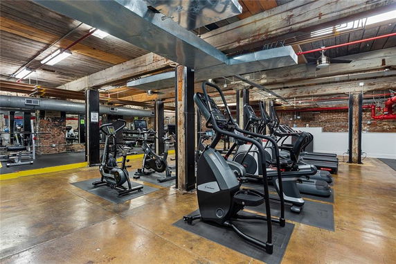 Indoor gym area with various exercise equipment.