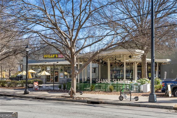 Front view of a restaurant building with patio seating.