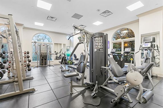 Interior view of a gym with various exercise equipment and machines.
