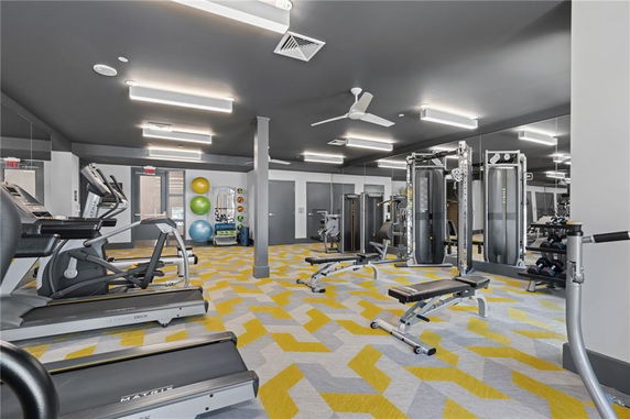 Indoor gym area with various exercise equipment.