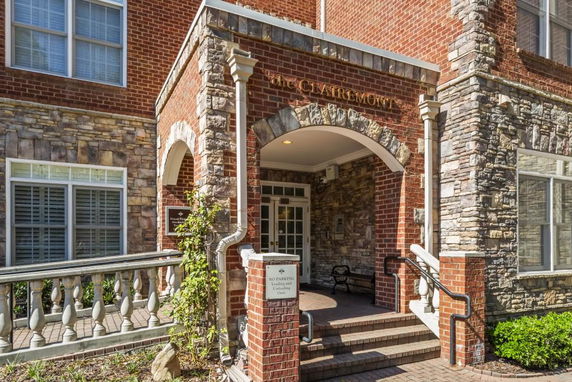 Front entrance of a brick and stone residential building
