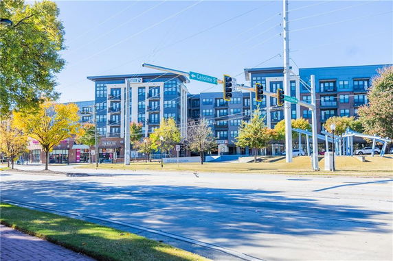 Street view showing a multi-story building with a modern facade.