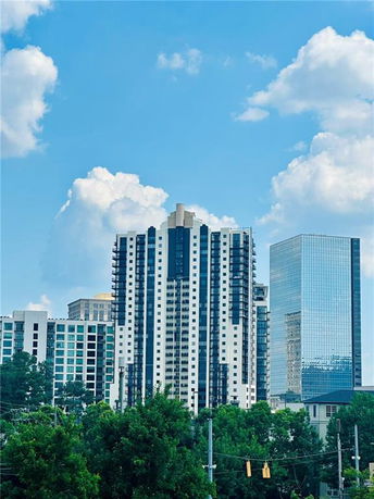 Front view of a tall, modern skyscraper building.