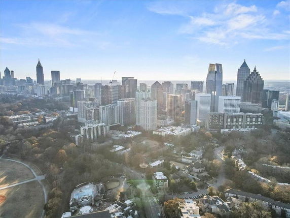 Aerial view of a city skyline with numerous skyscrapers and buildings.