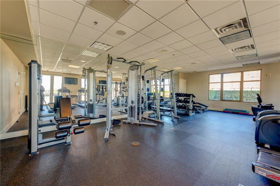 Interior view of a gym with various exercise equipment