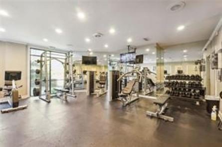 Indoor gym area with various exercise equipment.