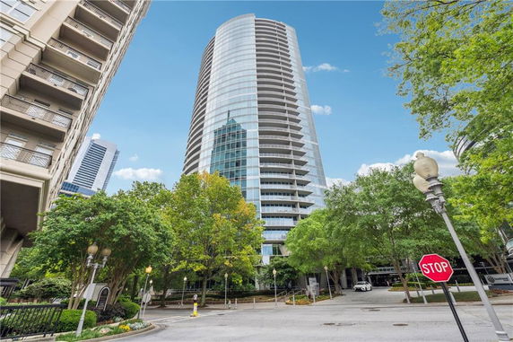 Front view of a modern high-rise building with glass facade.