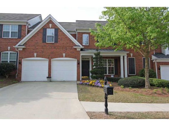 Front view of a two-story house with a double garage.