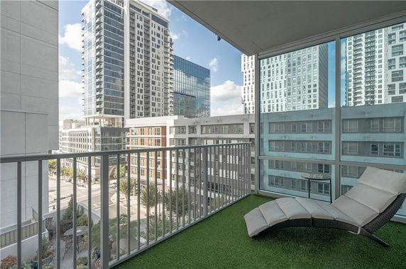 Balcony view of modern high-rise buildings in an urban area.