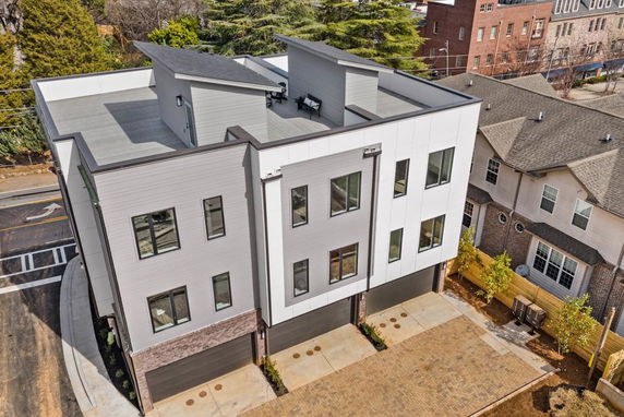 Front view of a modern multi-story building with a flat roof.