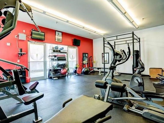 Indoor gym area with fitness equipment.