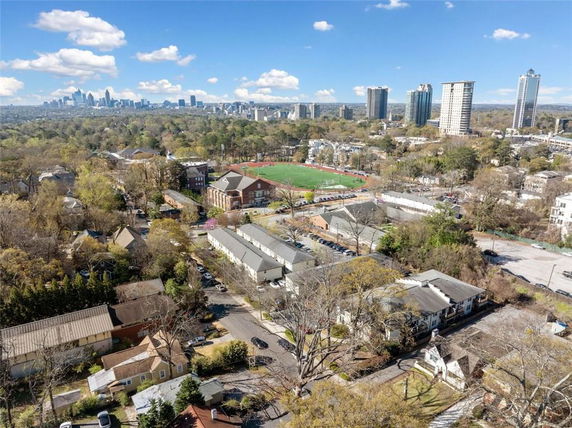 Panoramic view of a cityscape with buildings and surrounding areas.
