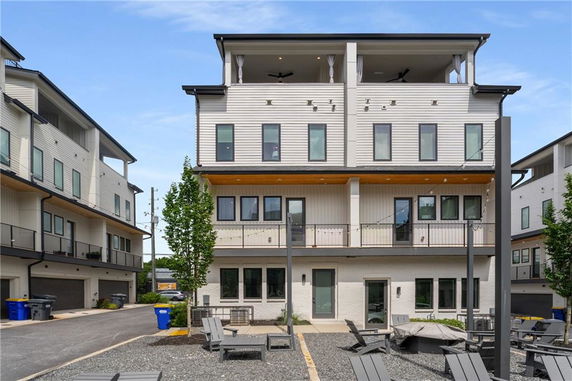 Front view of a multi-story residential building with balconies.