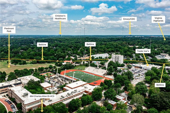 Aerial view of a city landscape including various landmarks labeled in the distance.