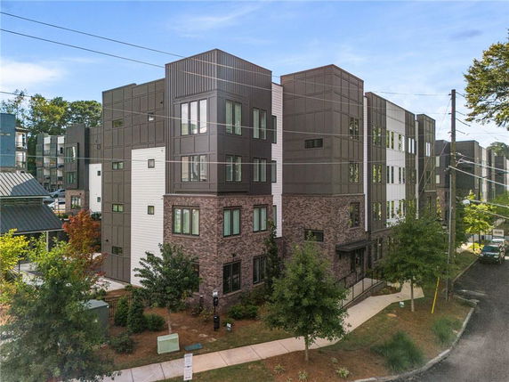Front view of a multi-story residential building with modern design.