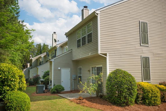 Side view of a two-story townhouse.