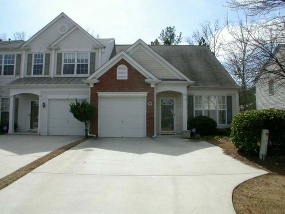 Front view of a house with an attached garage.