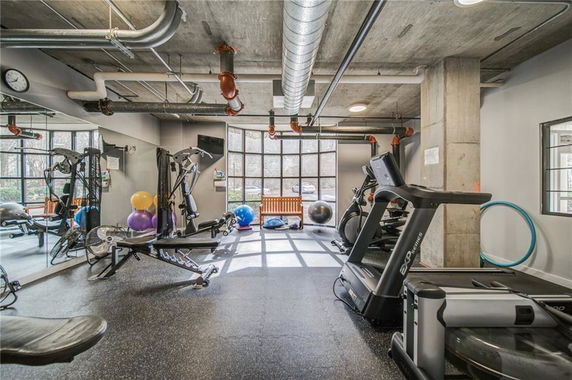 Interior view of a gym with exercise equipment.