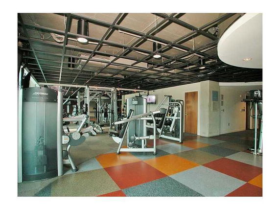 Interior view of a gym area with various exercise machines.