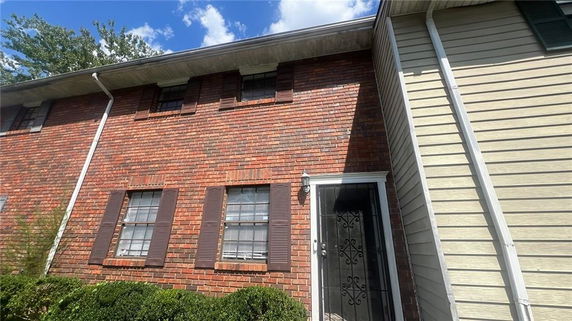 Front view of a two-story brick house.