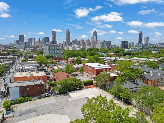 Panoramic view of a cityscape with tall buildings and residential areas.
