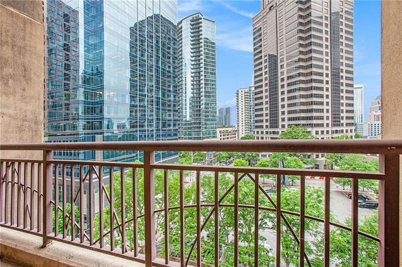 View of surrounding skyscrapers from a balcony.