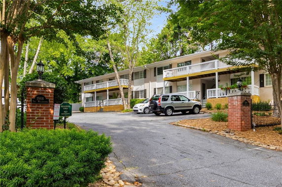 Front view of a two-story residential building with multiple balconies.