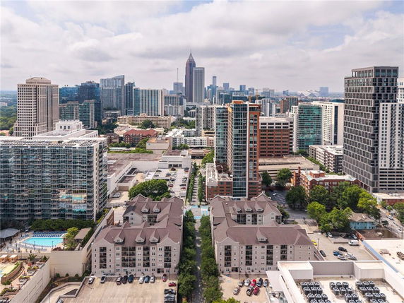 Panoramic view of a cityscape with tall buildings and residential areas.